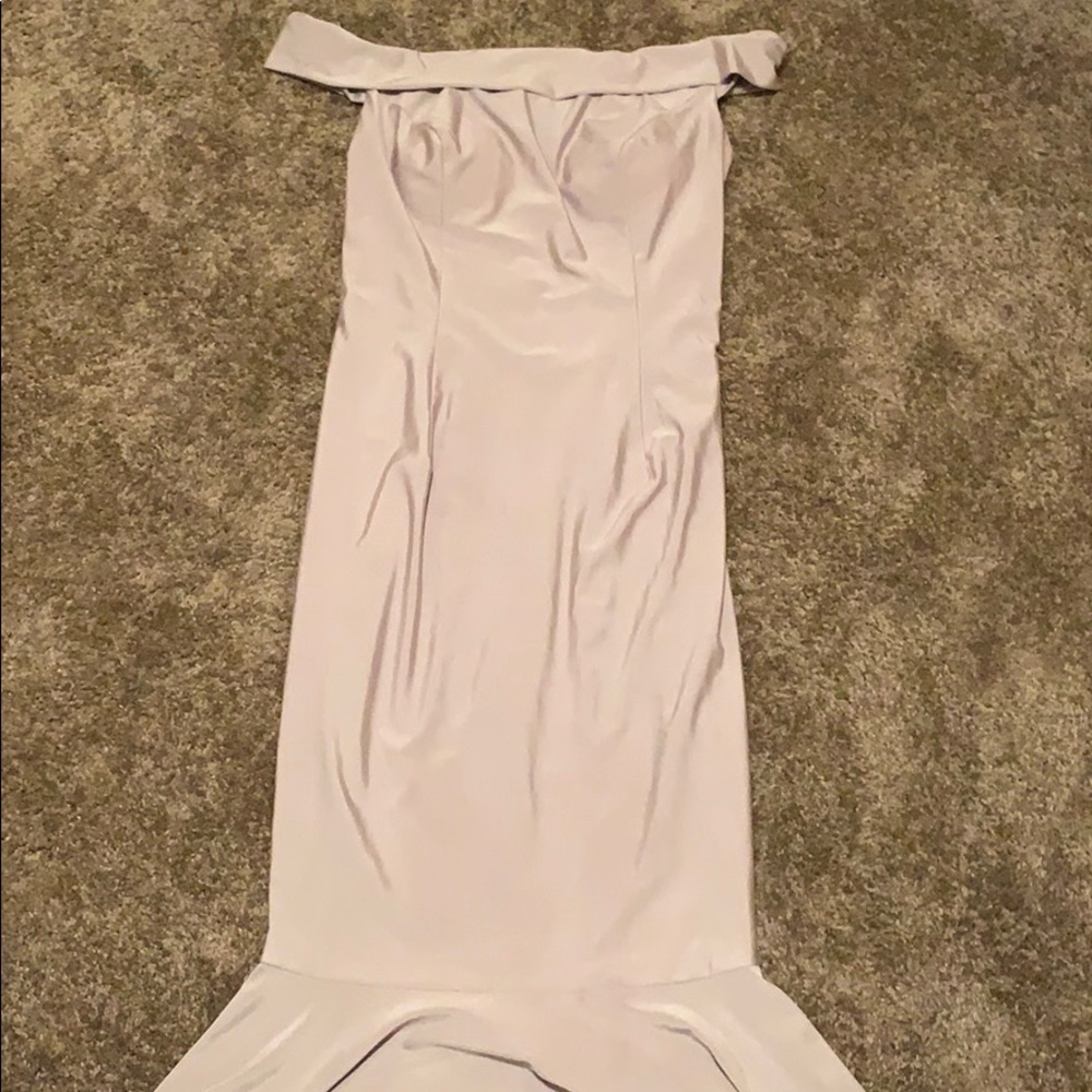 Off the shoulder silver dress.